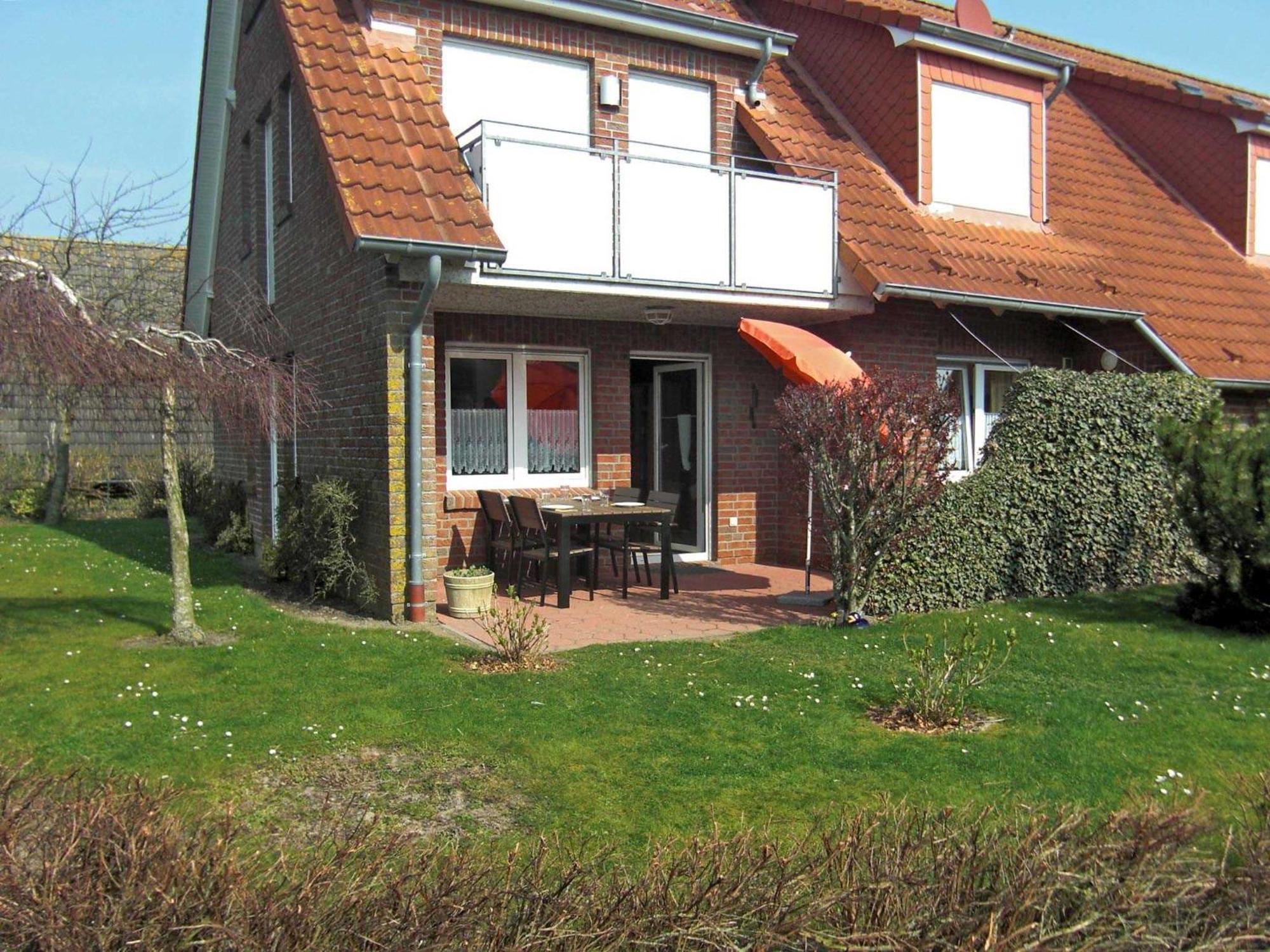 Apartamento Haus "An Der Kurpromenade" Harlesiel Exterior foto